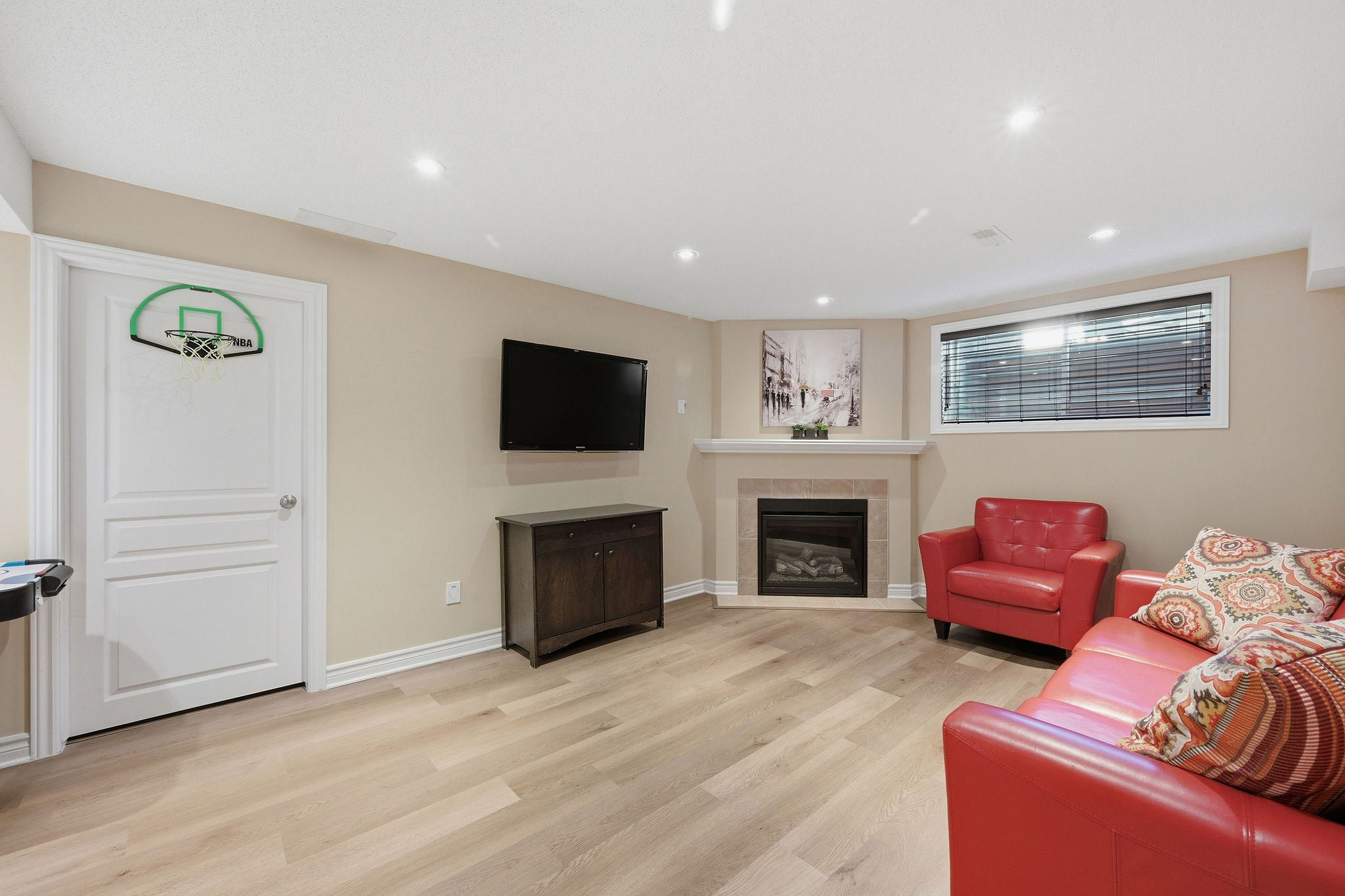 Finished lower level family room with fireplace