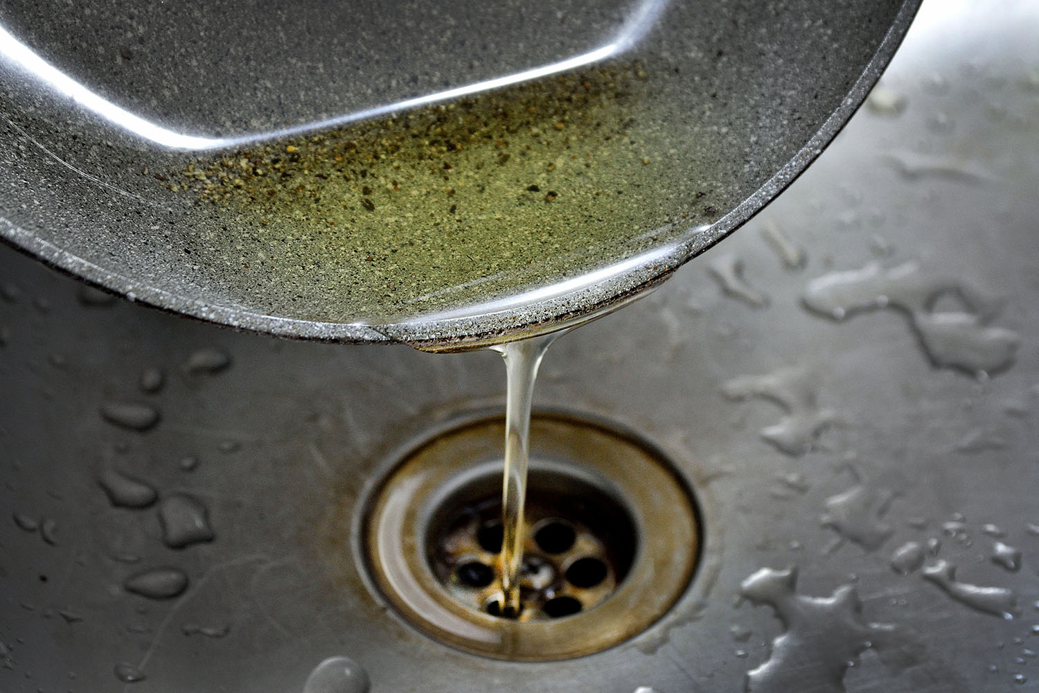 old-oil-poured-into-kitchen-sink.jpg
