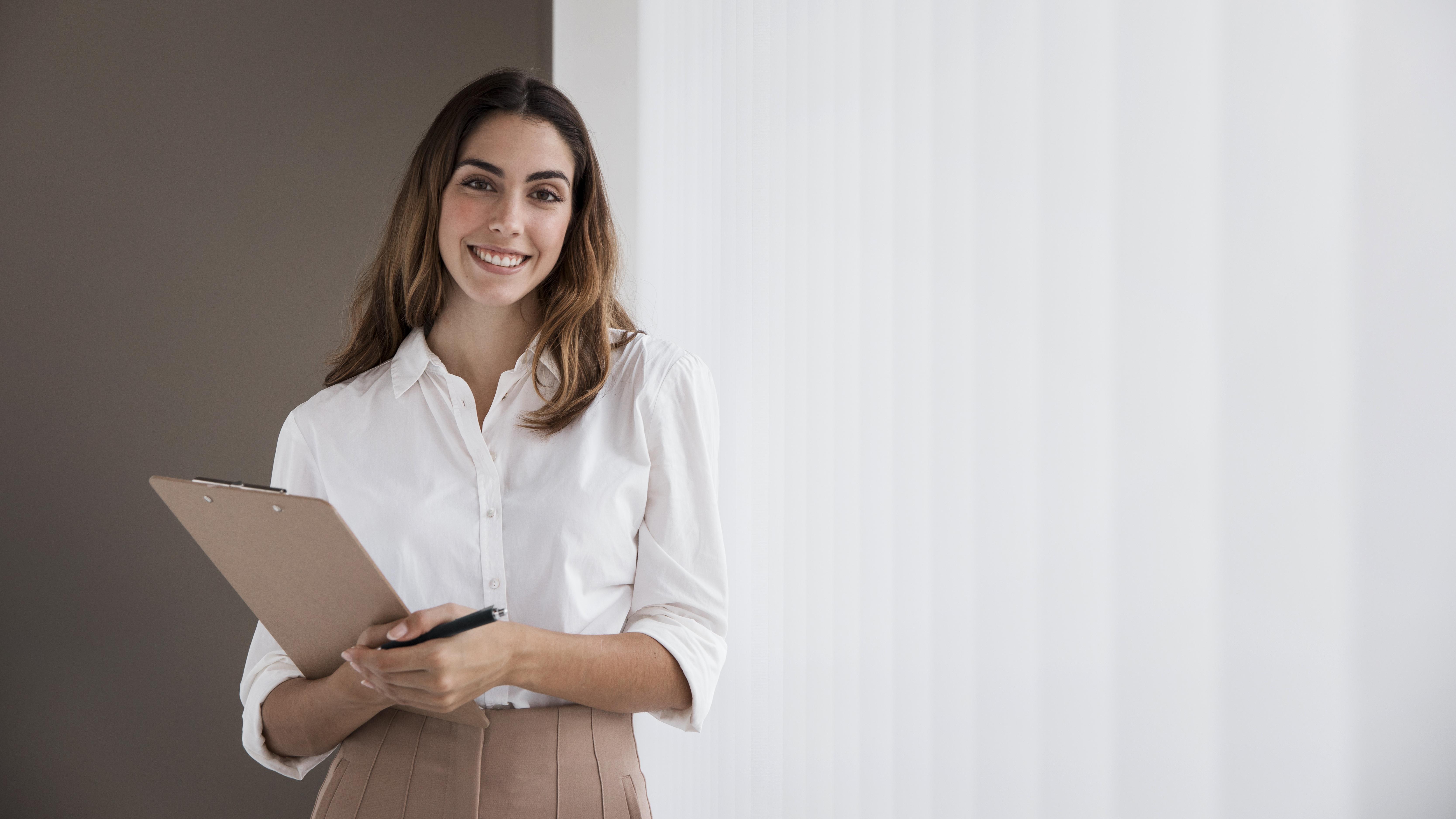 front-view-elegant-businesswoman-holding-clipboard-with-copy-space.jpg