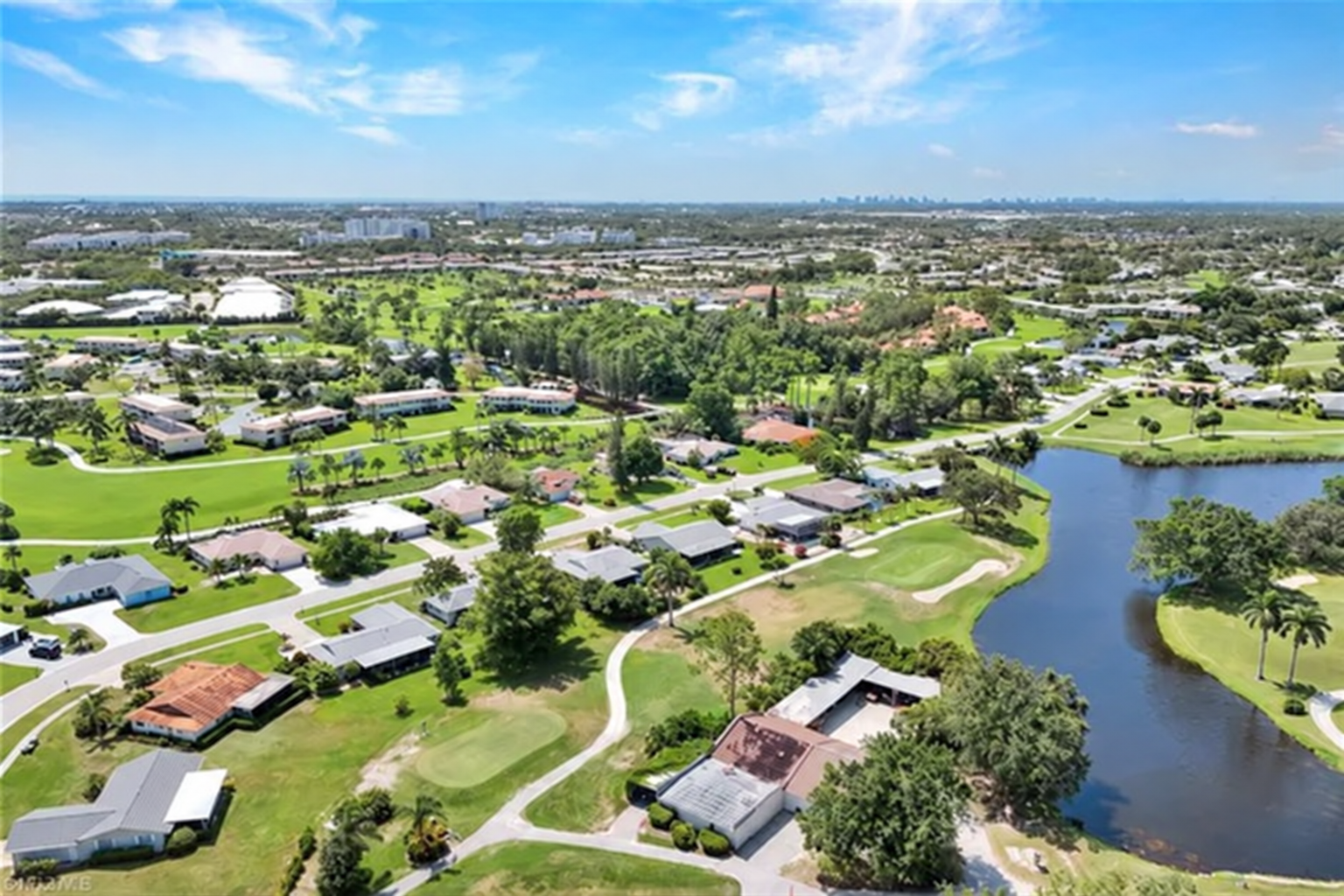 Aerial view of Lakewood homes, lakes and golf-course surroundings in Naples, Florida