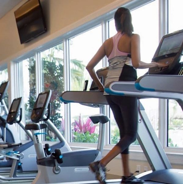 Naples Reserve fitness center overlooking the Island Club pool and Eagle Lake