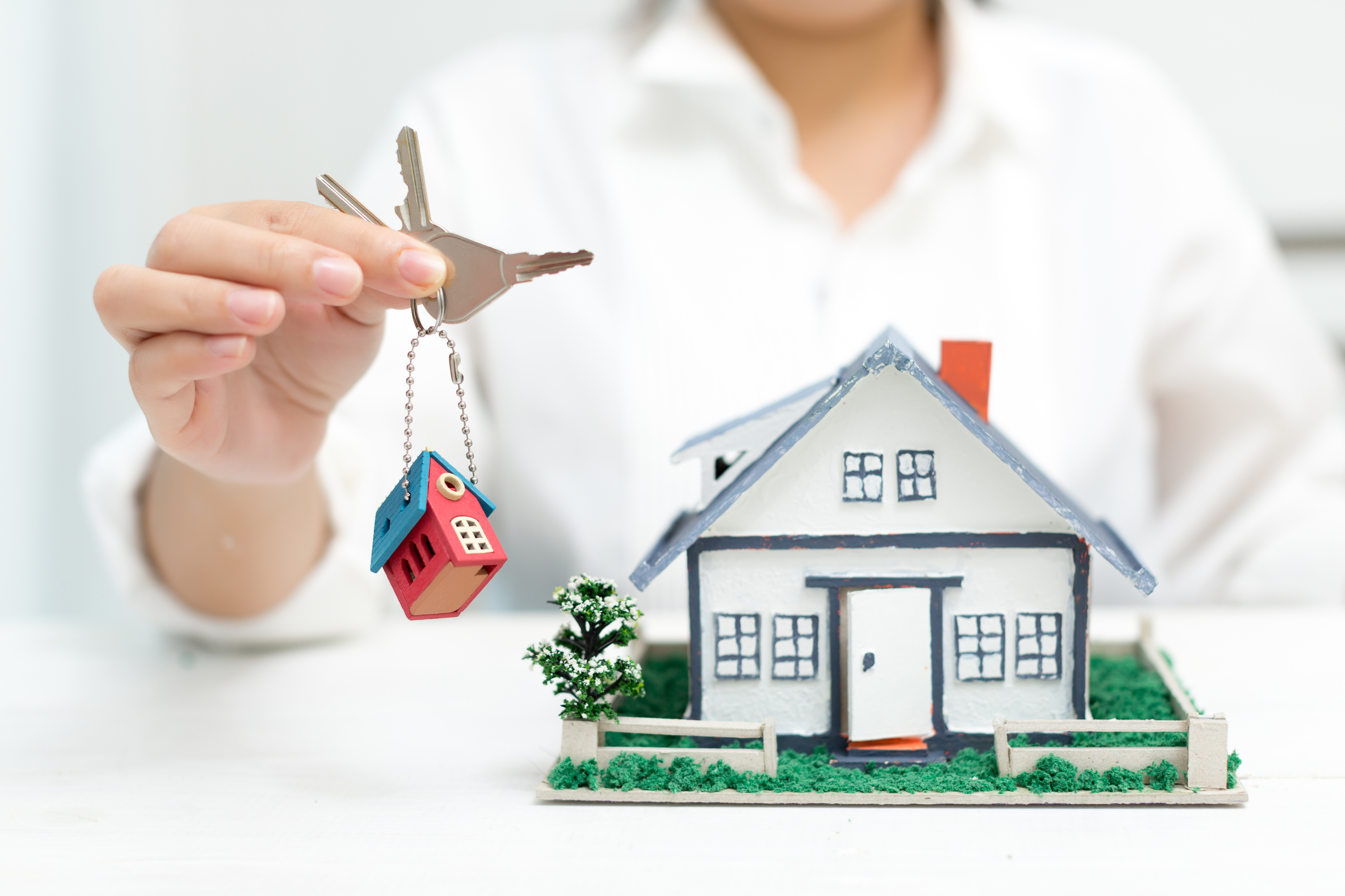 real-estate-agent-with-house-model-keys (1).jpg