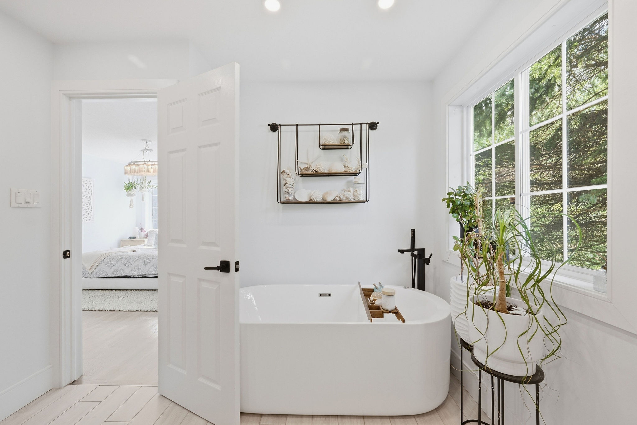 Freestanding tub in the renovated primary ensuite