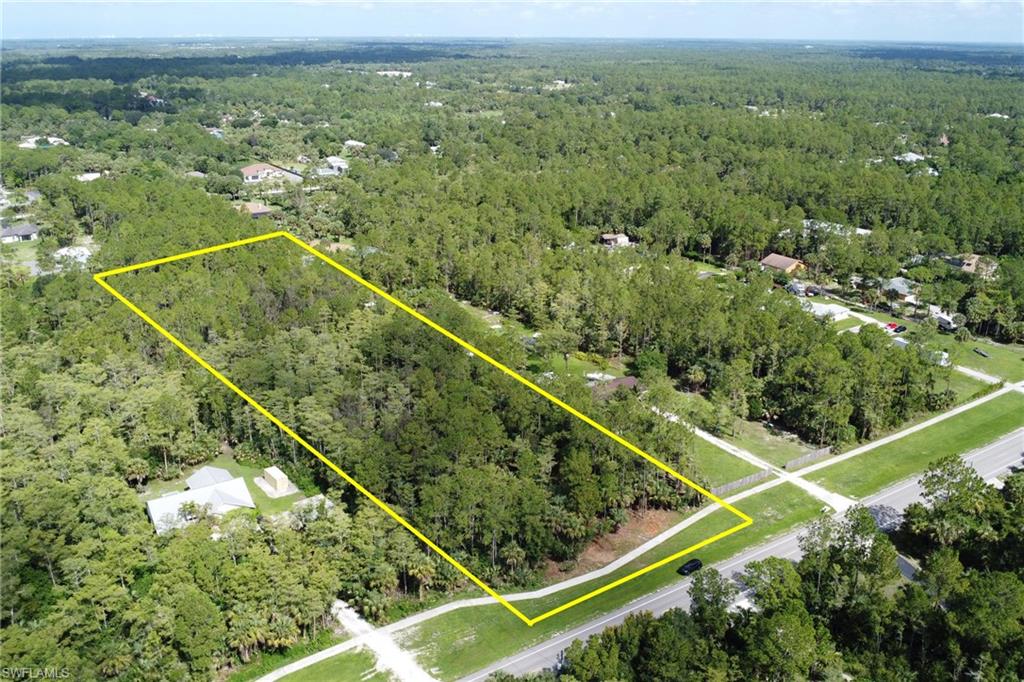 Aerial view of a wooded vacant parcel in Golden Gate Estates, Naples, Florida