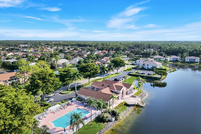 Crown Pointe Naples clubhouse swimming pool and freshwater lake community amenities