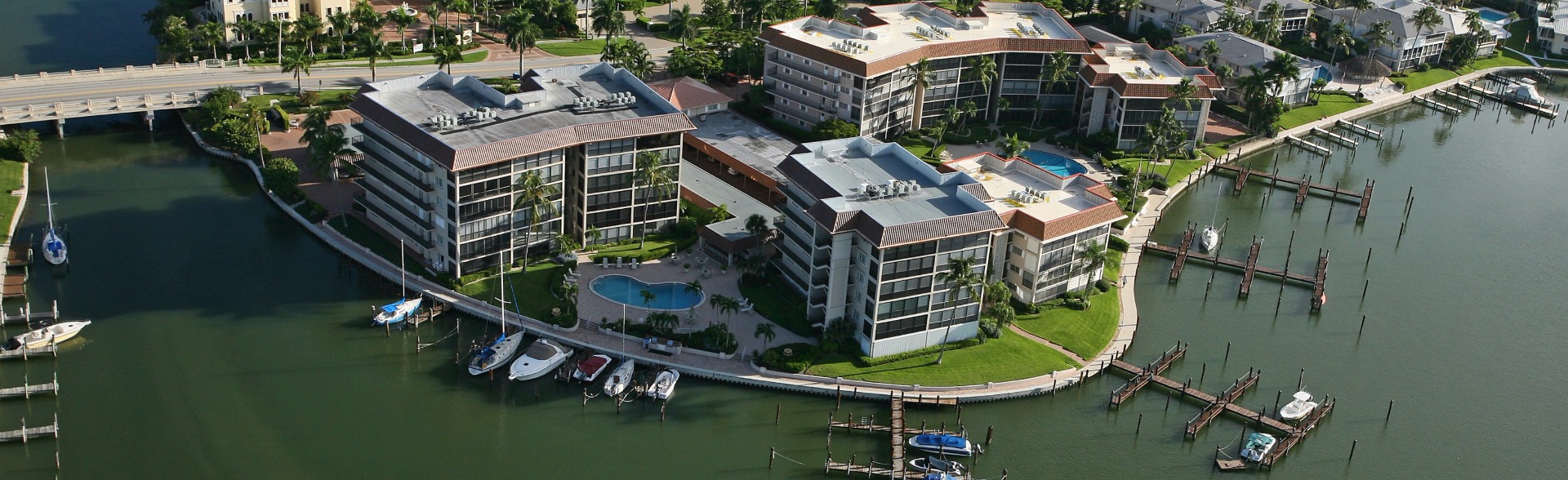Commodore Club bayfront condominiums on Moorings Bay in Naples Florida