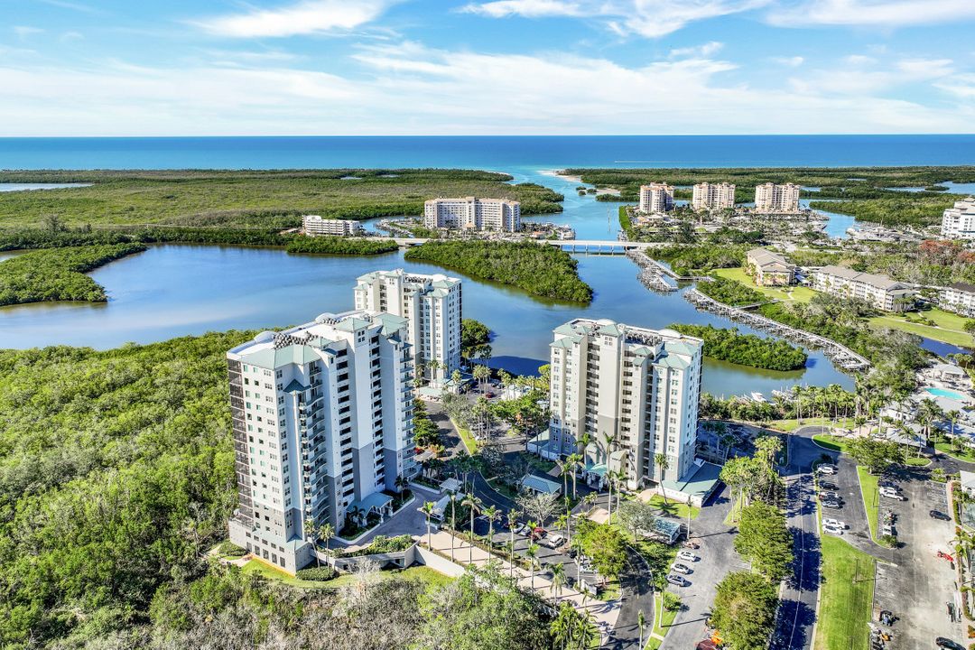 Aerial view of Cove Towers waterfront condos on Wiggins Bay in North Naples Florida