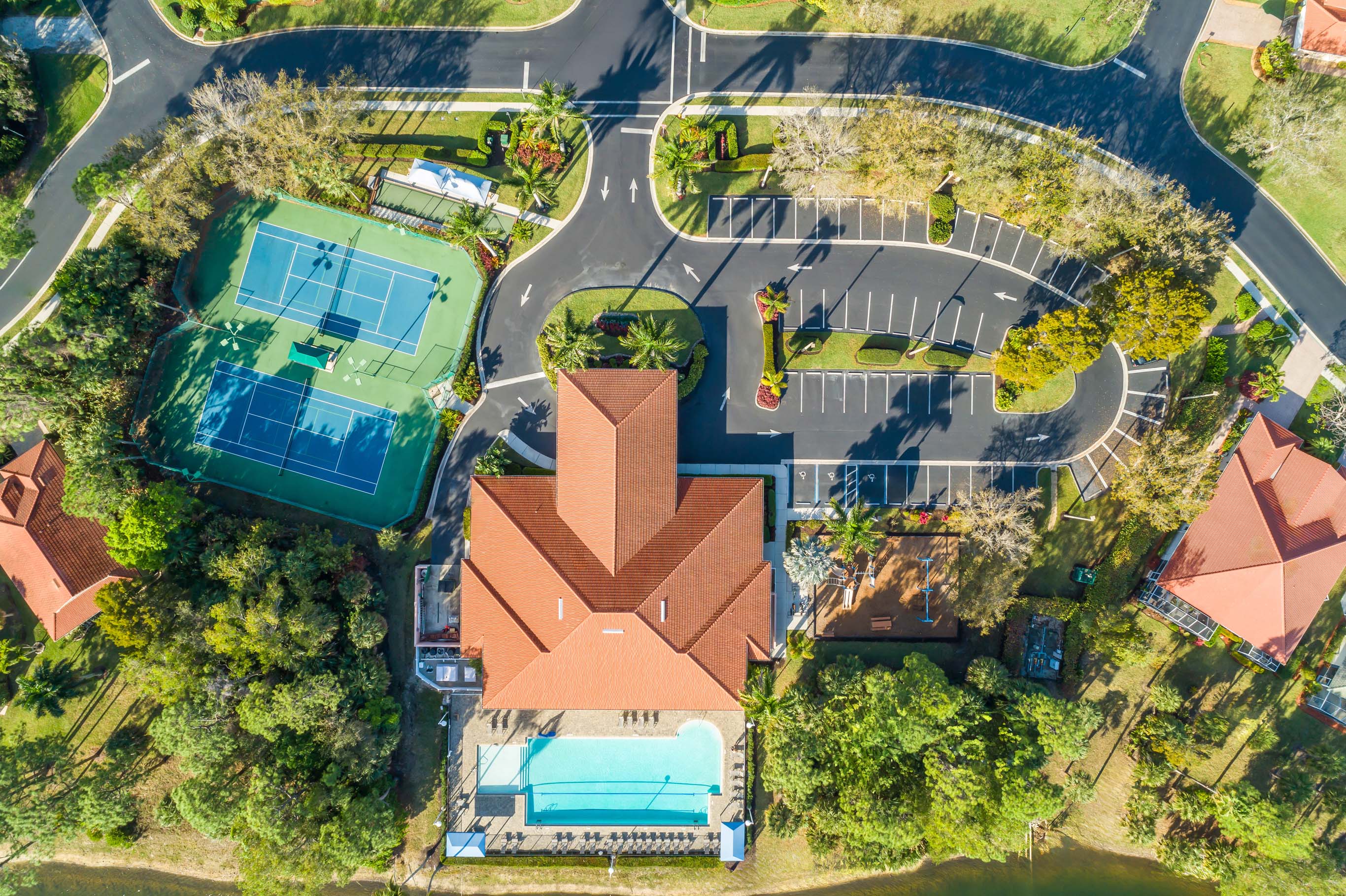 Aerial view of The Shores at Berkshire Lakes clubhouse pool tennis pickleball and community amenities in Naples FL