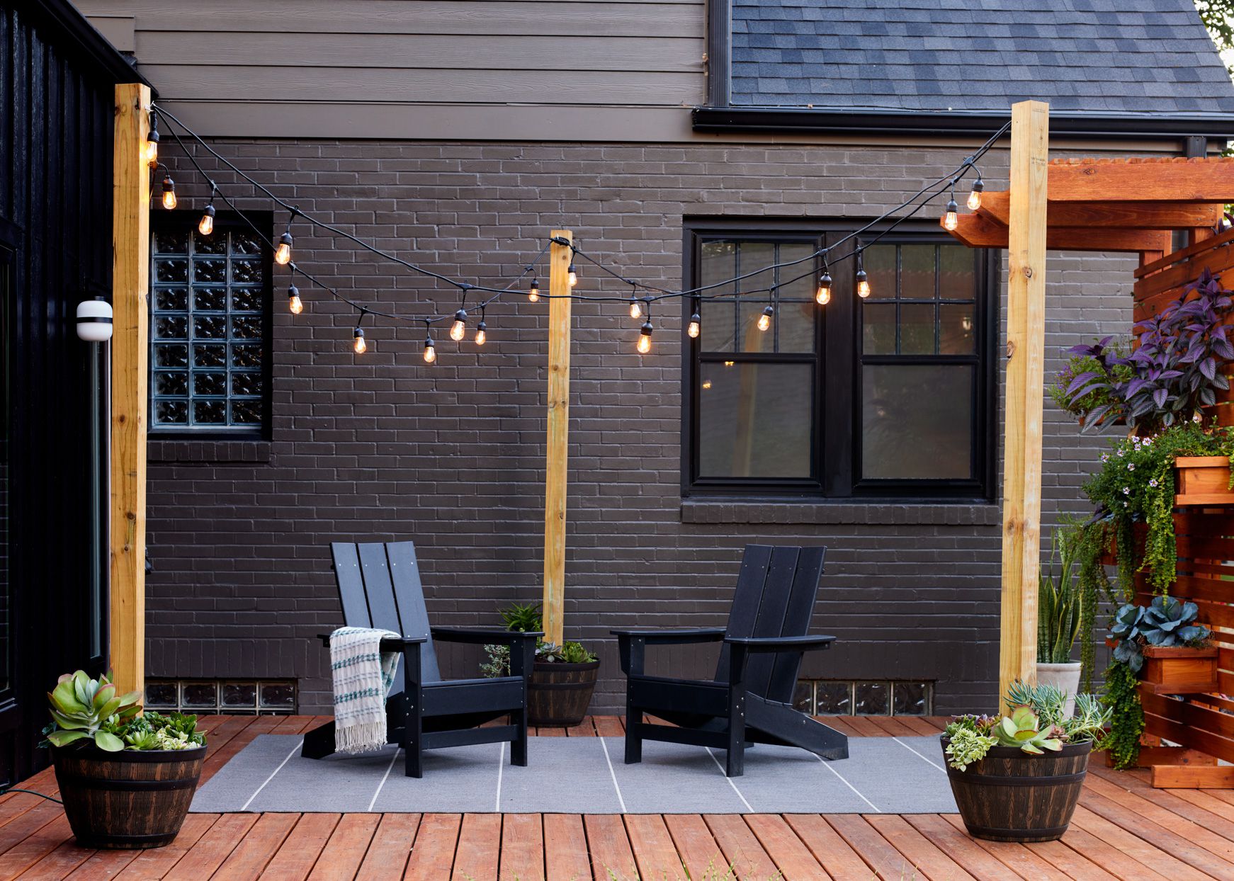 deck-black-adirondack-chairs-string-lights-287pDuxpK1kB-couHQHSzo-2f98a7c1b0ad425d8d1d89fe1a9da282.jpg
