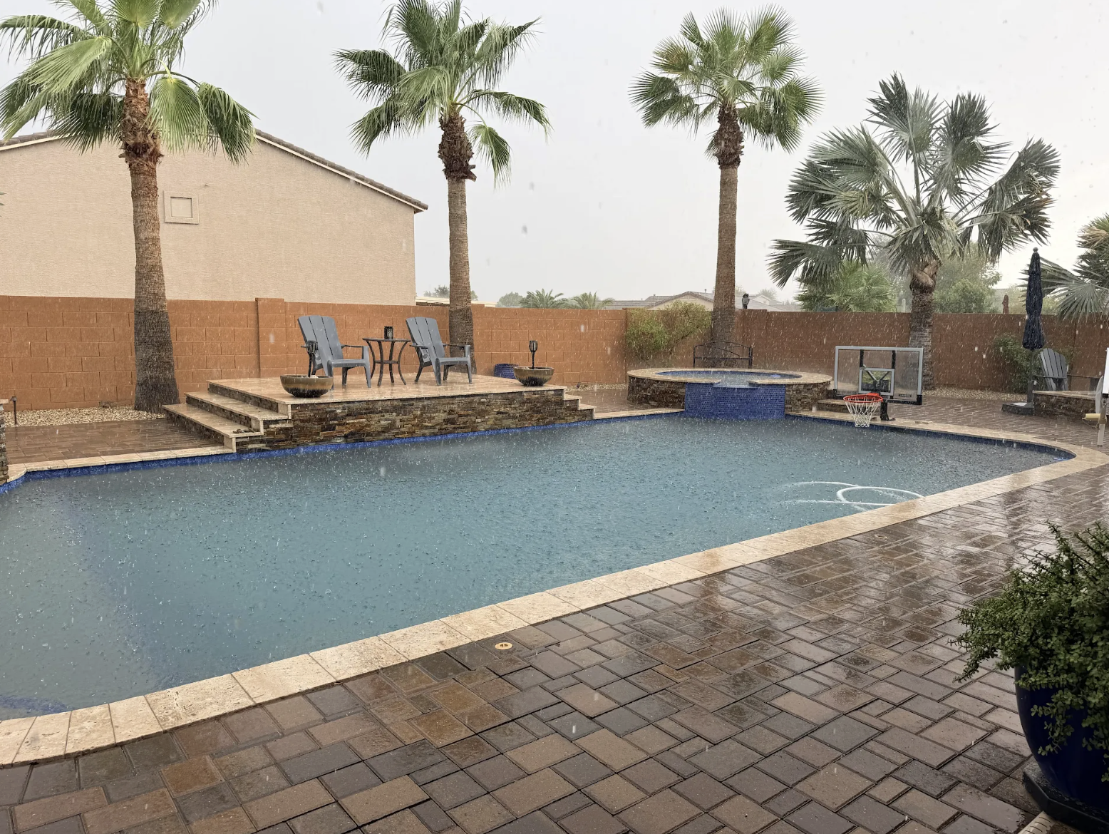 Arizona monsoon storm over a backyard pool