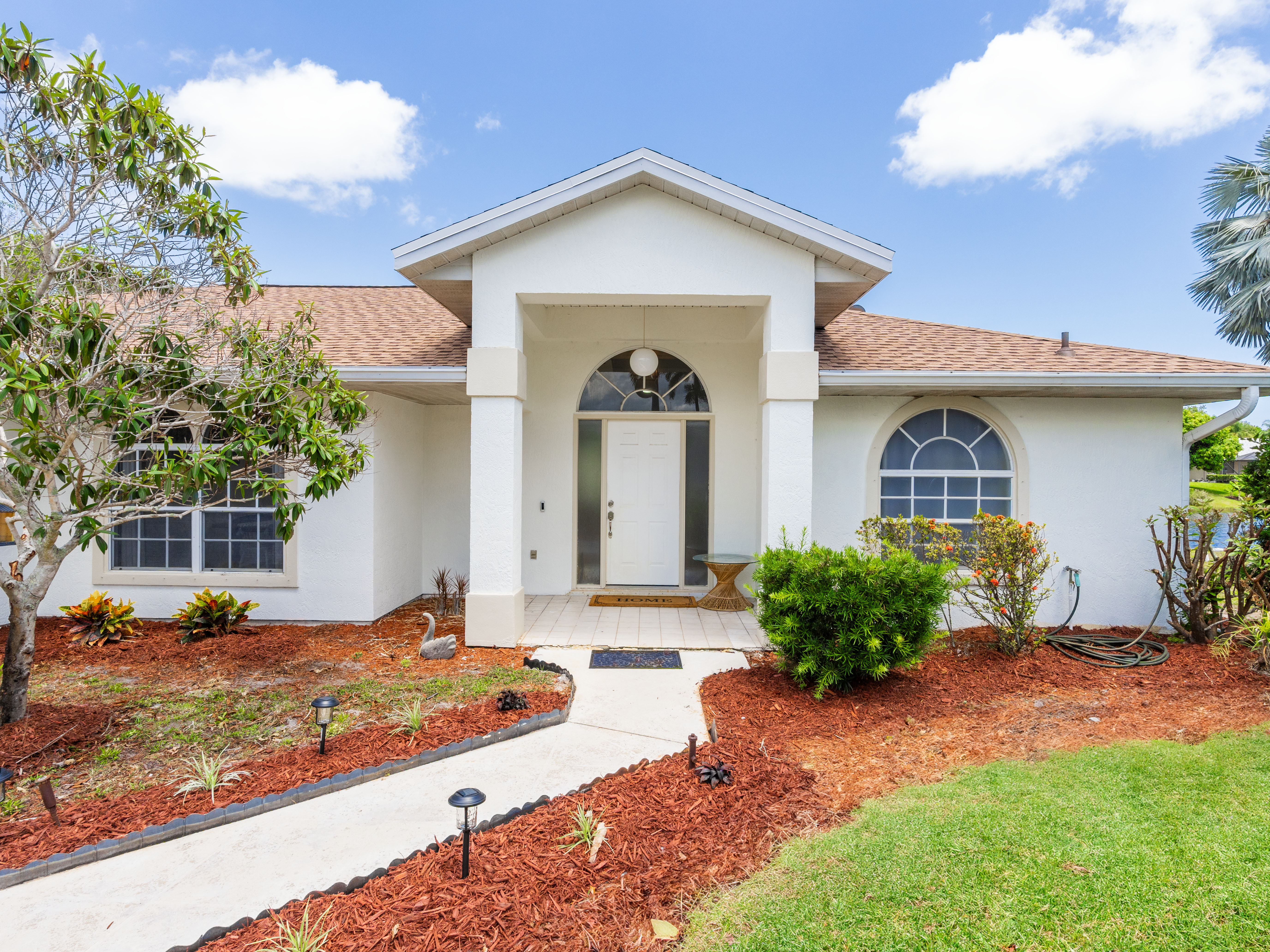 New Listing!  Lakefront + Pool Home in Palm City!