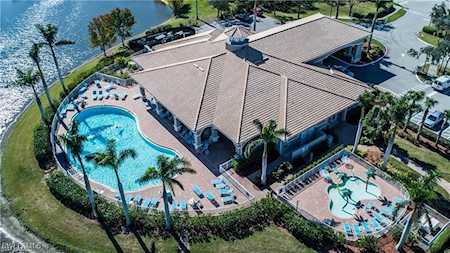 Reflection Lakes of Naples clubhouse resort pool lake and community amenities in Naples Florida