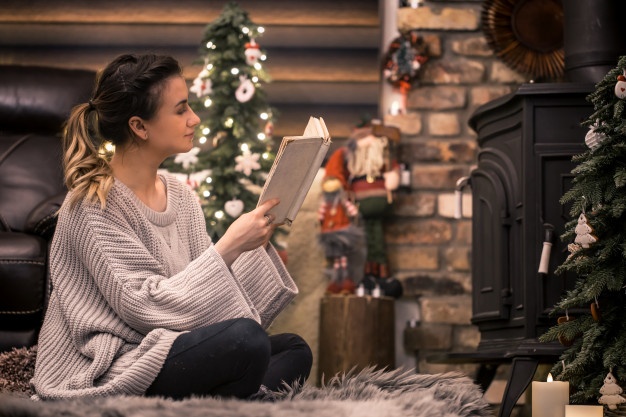 girl-reading-book-cozy-home-atmosphere-near-fireplace_169016-1305.jpg